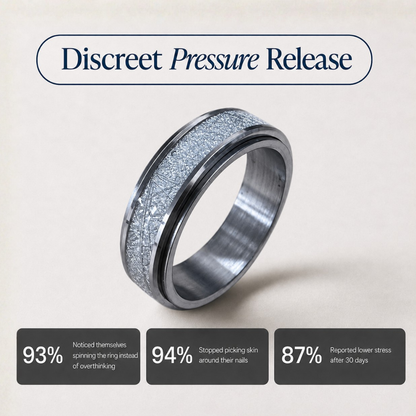 A silver-toned discreet pressure release spinning ring from Anxiety RIngs Australia with a textured, crackled metallic pattern on the outer band, shown on a light beige background with informational text overlays.