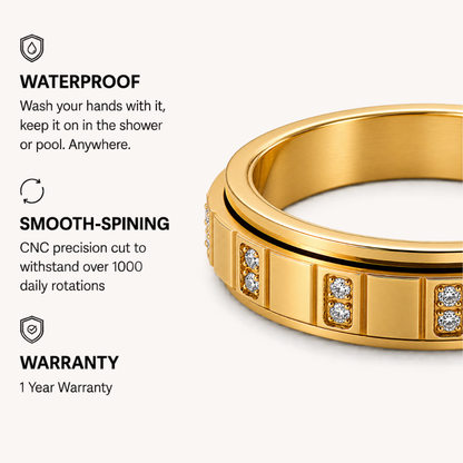 Gold-toned spinning ring from Anxiety Rings Australia band with inset clear stones, shown on a light beige background with marketing text highlighting waterproof, smooth-spining, and warranty features.